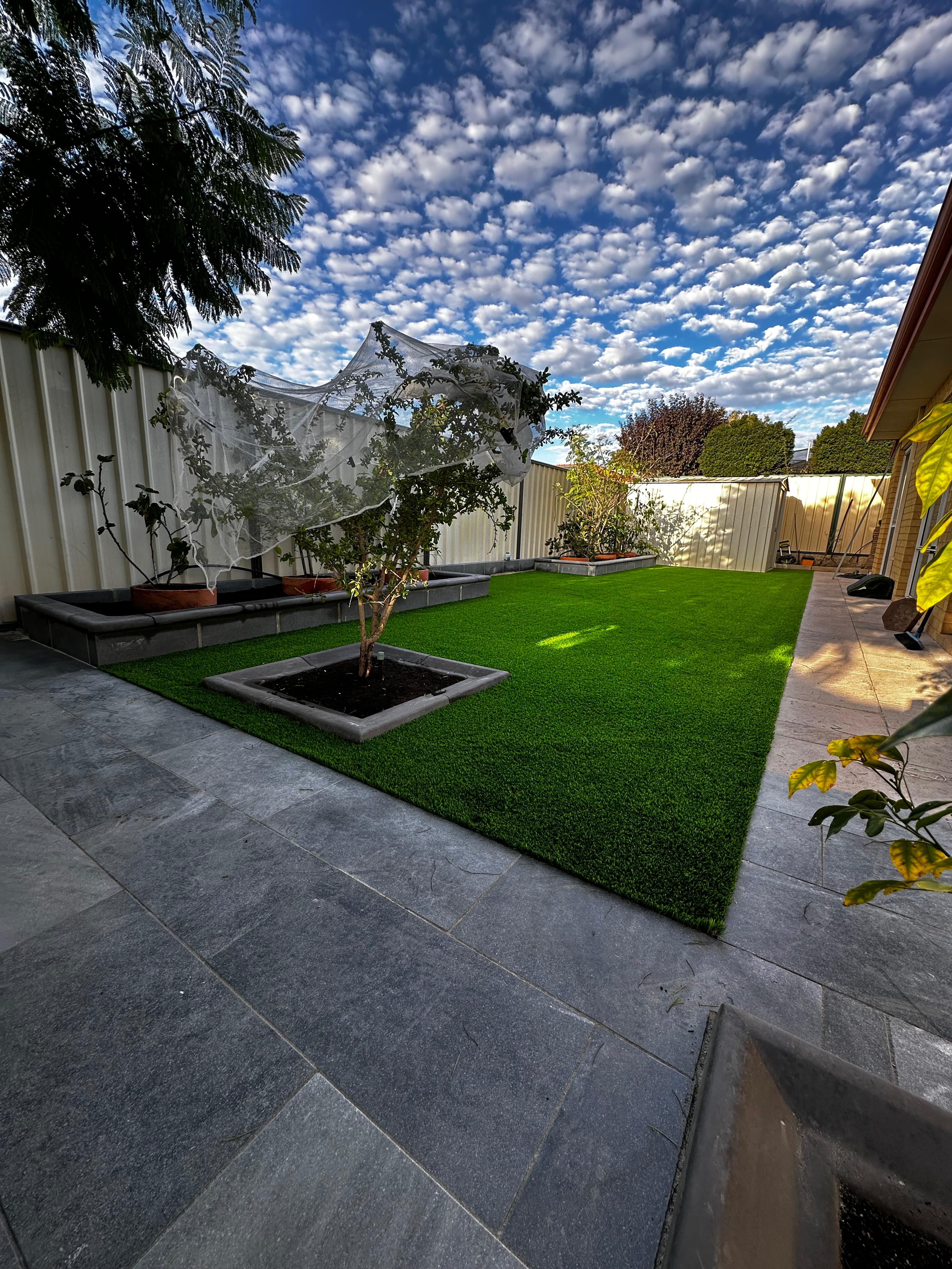 Finished artificial turf backyard