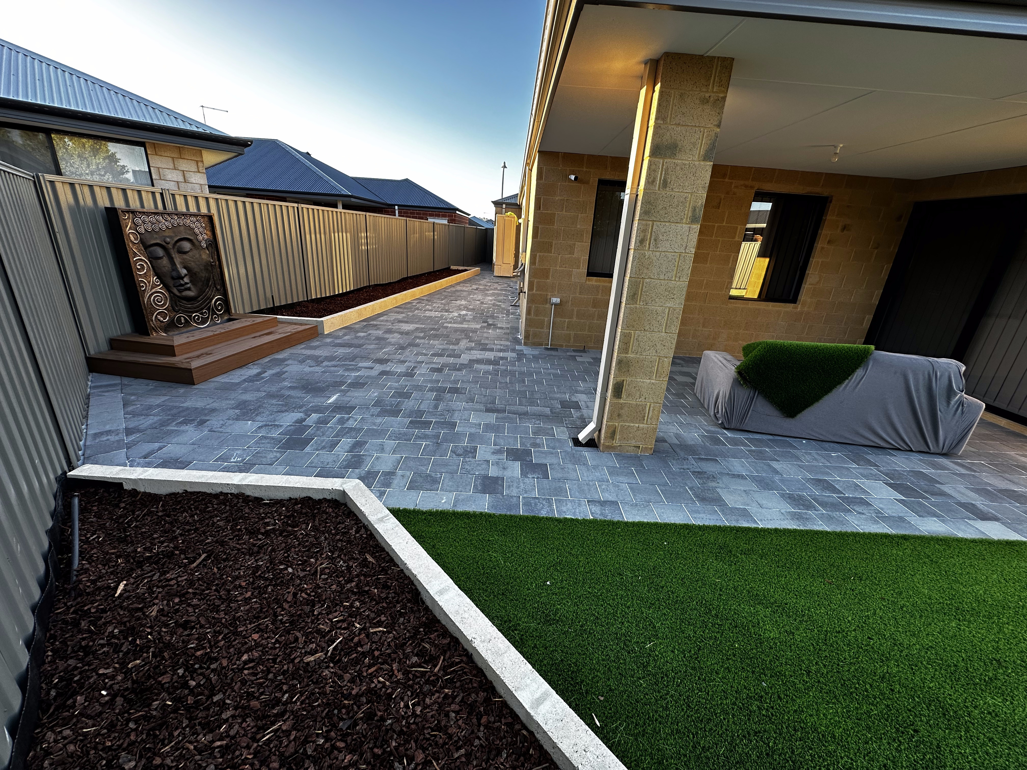 Paved alfresco patio with feature wall