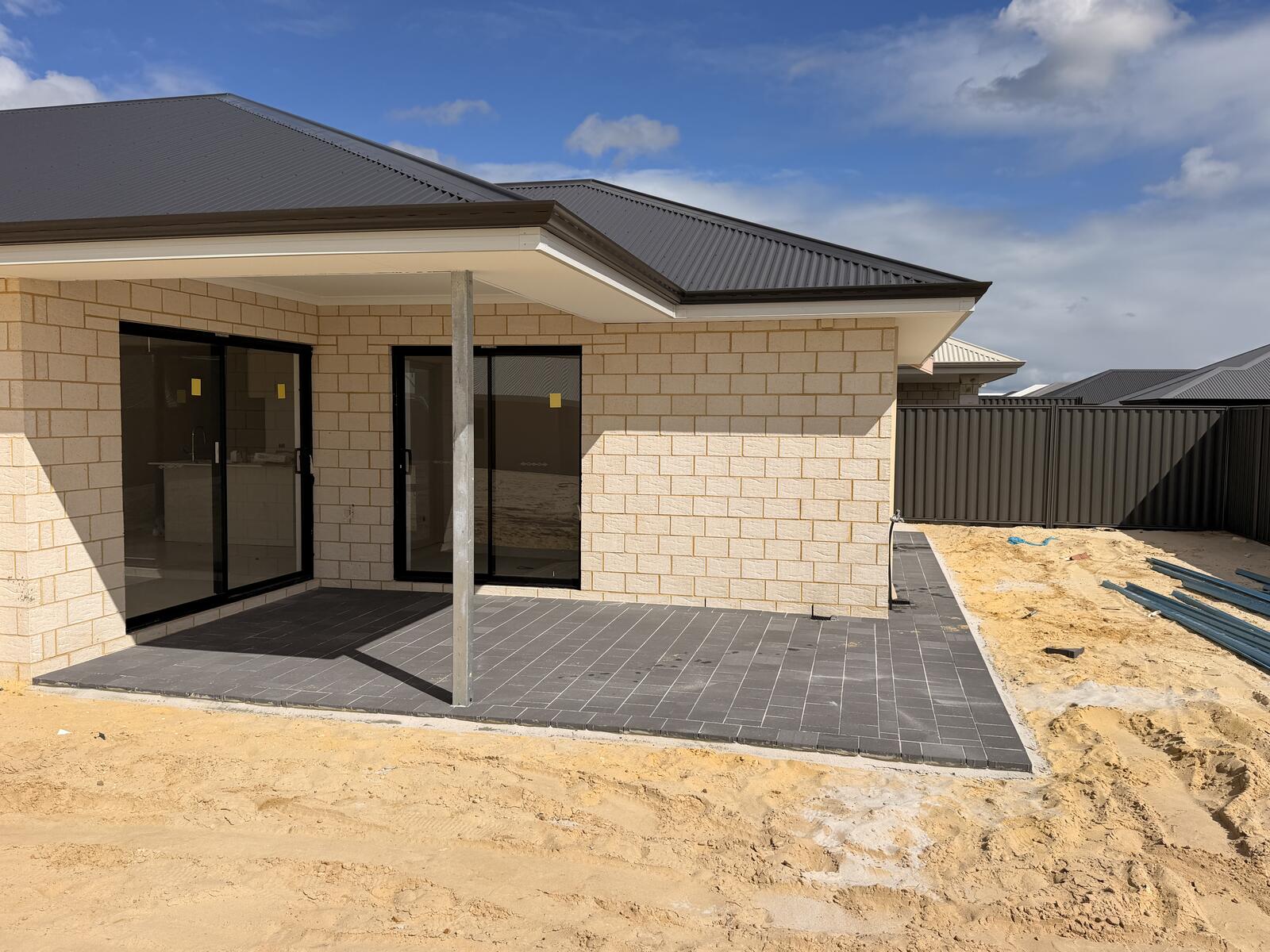 Charcoal paver alfresco patio at a new build