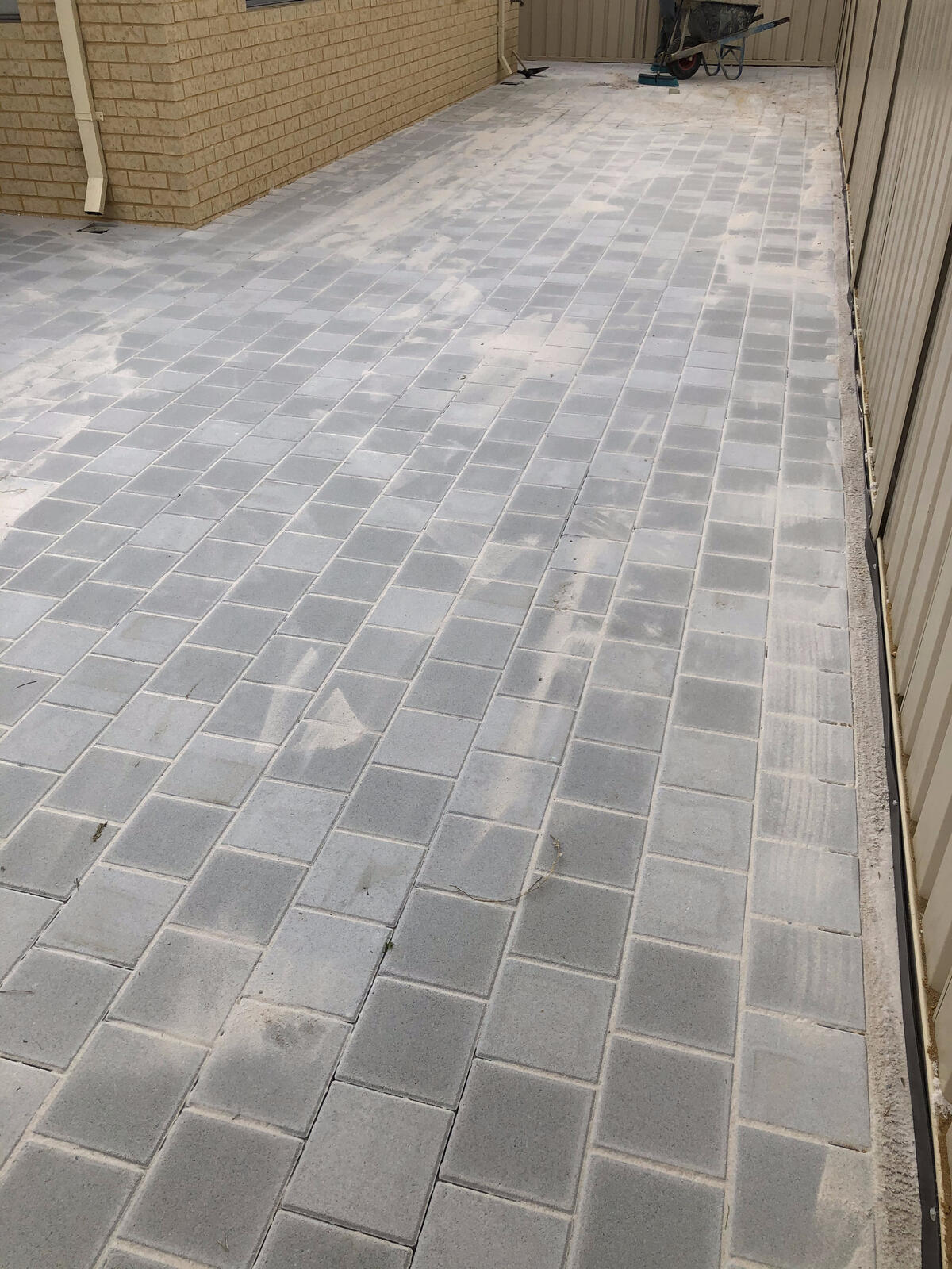 Grey square paver side path