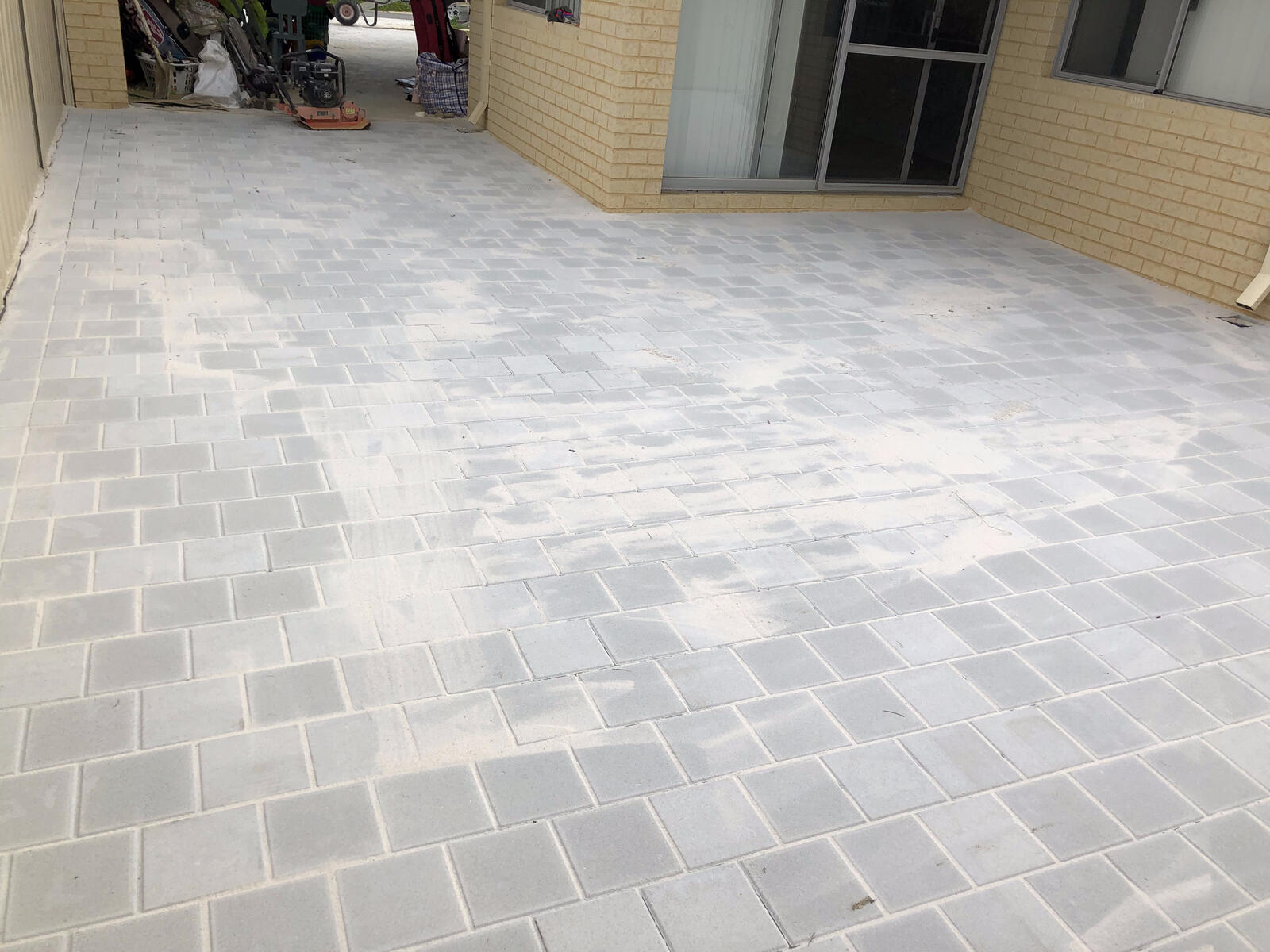 Grey square paver patio
