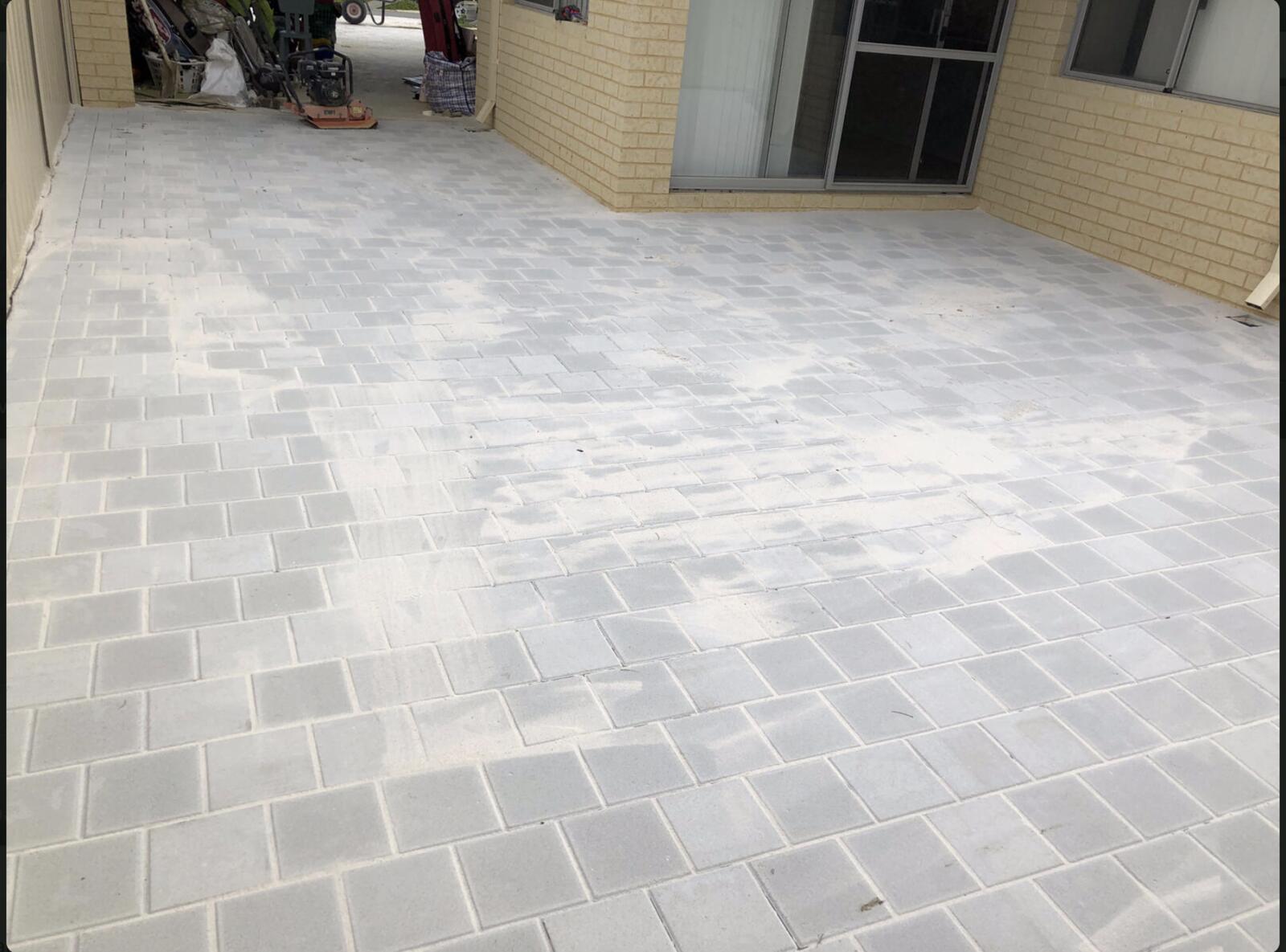 Paved patio and alfresco area beside the home