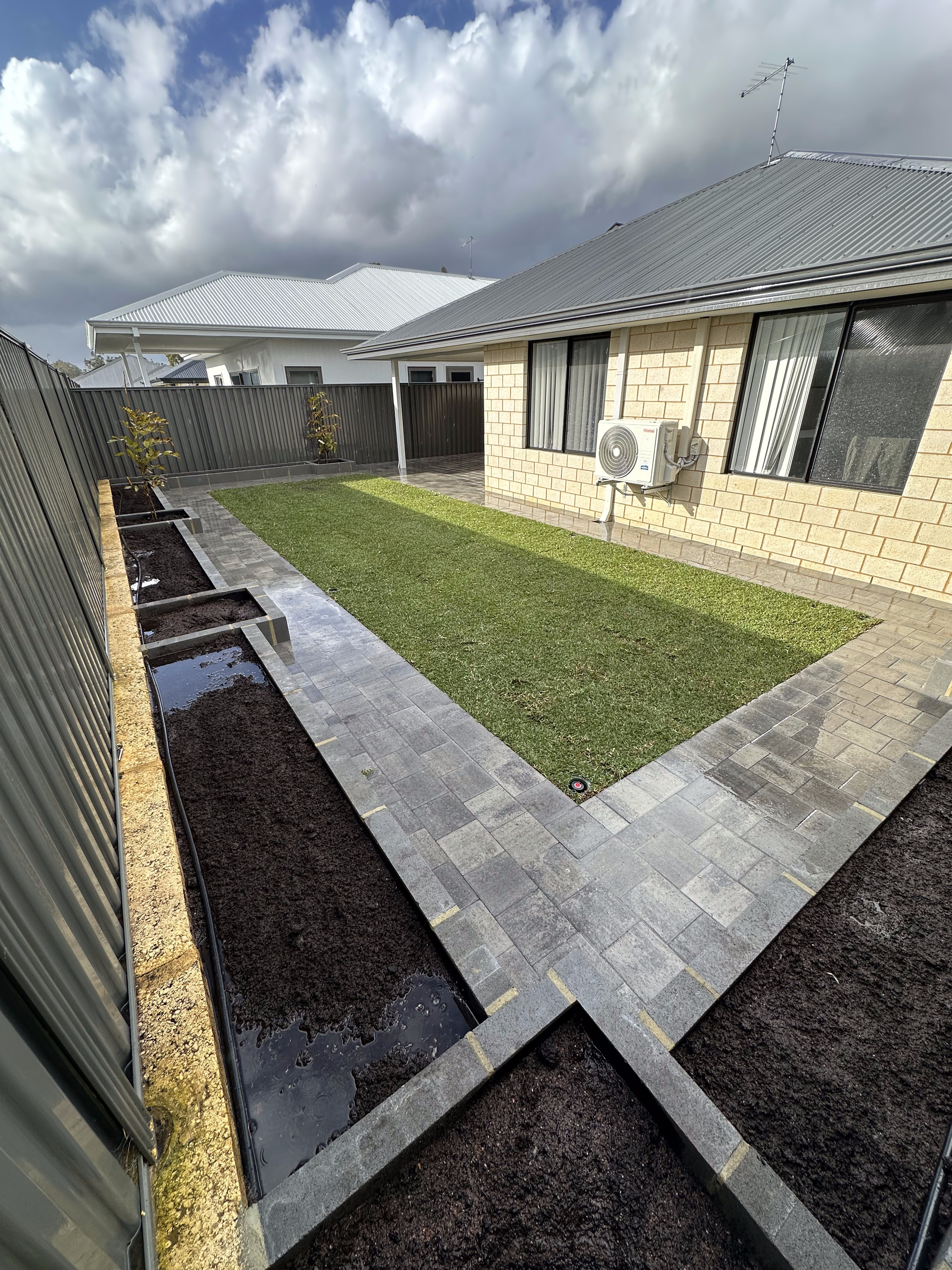 Charcoal limestone garden bed and planter boxes