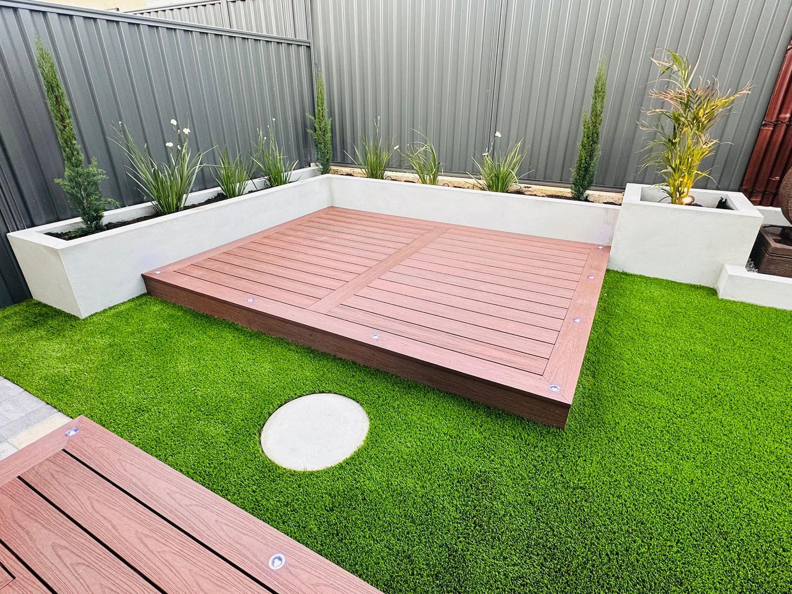 Composite deck with garden planter boxes at dusk